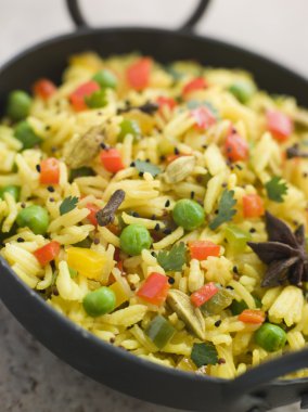 Close up image of Vegetable Pilau Rice in a Balti Dish clipart