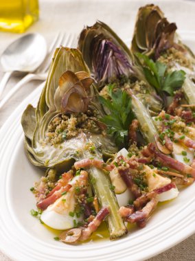 Plate of Roasted Globe Artichokes with Pancetta Egg and Garlic Breadcrumbs clipart