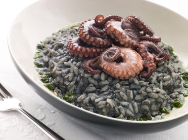 Risotto Nero with Fried Octopus and Pesto Dressing clipart
