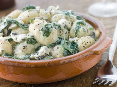 Dish of Gnocchi and Spinach with a Gorgonzola Cream Sauce clipart