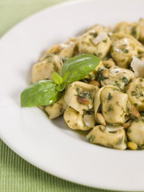 Chicken and Mushroom Tortelinni with Pesto and Pine Nuts clipart