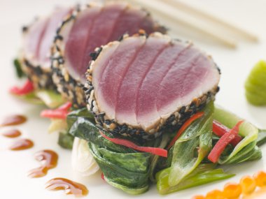 Seared Yellow Fin Tuna with Sesame Seeds Sweet Fried pac Choi an clipart