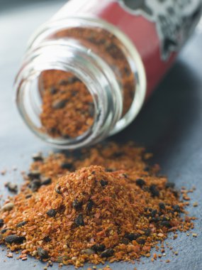 Jar of Shichimi Togarashi Pepper spilling out clipart