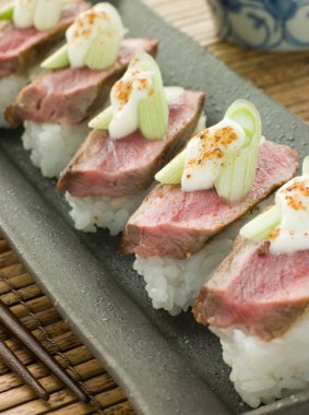 Plate of Beef Nigri with Horseradish and Wasabi Cream clipart