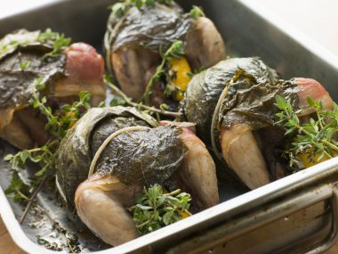 Quails Roasted in Vine Leaves with Lemon and Thyme clipart