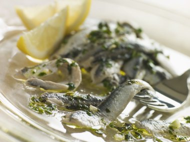 Anchovies marinated in Herbs Garlic and Lemon clipart
