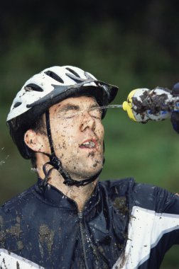 Mountain biker refreshing clipart