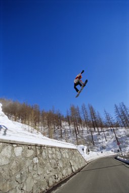 Young man snowboarding clipart