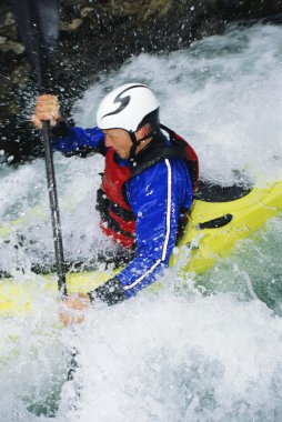 Man kayaking in rapids clipart