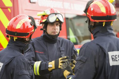 A firefighter giving instructions to his team clipart