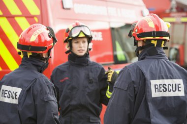 A firefighter giving instructions to her team clipart