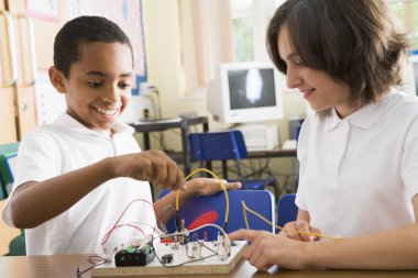 Schoolchildren in a science class clipart