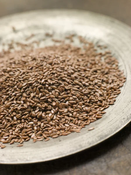 Close Brown Linseed Pewter Plate — Stock Photo, Image