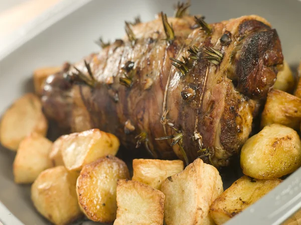 Roast Leg of Lamb Studded with Garlic and Rosemary and Roast Pot — Stock Photo, Image