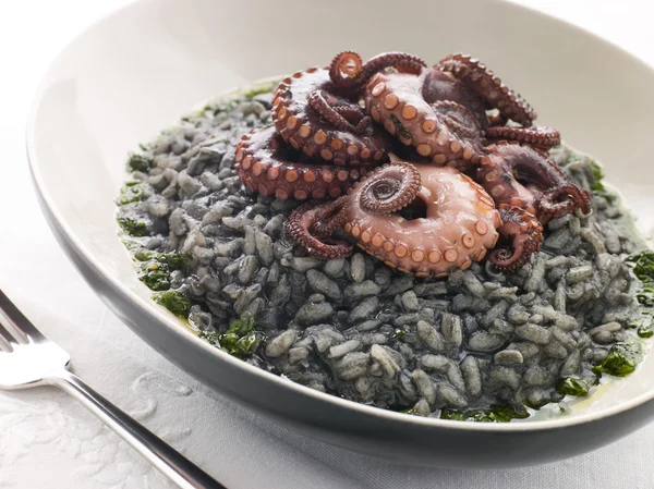 Risotto Nero with Fried Octopus and Pesto Dressing — Stock Photo, Image