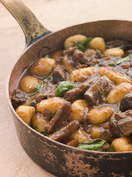Oxtail Braised in Red Wine with Basil Gnocchi — Stock Photo, Image