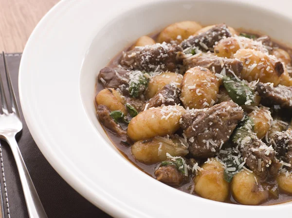 Oxtail Braised in Red Wine with Basil Gnocchi and Parmesan Chees — Stock Photo, Image