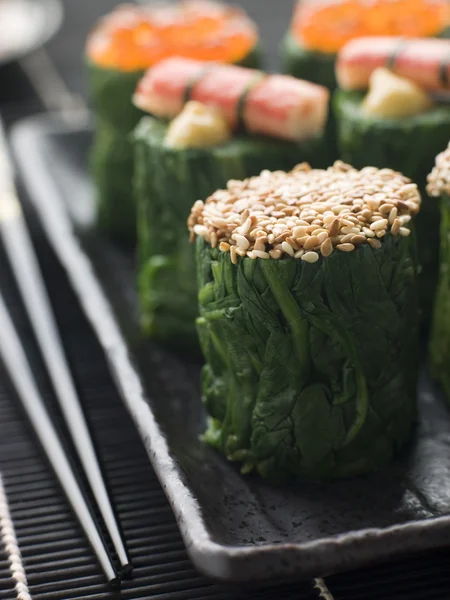 Rolled Spinach Three Ways-Snow Crab Toasted Sesame Seeds and sal — Stock Photo, Image