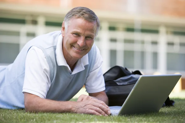 Man Using Laptop While Lying Grass Campus — Stock Photo, Image