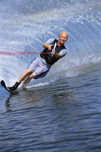 A young man water skiing — Stock Photo, Image