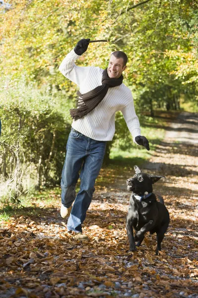 Man Exercising Dog Autumn Woodland — Stock Photo, Image