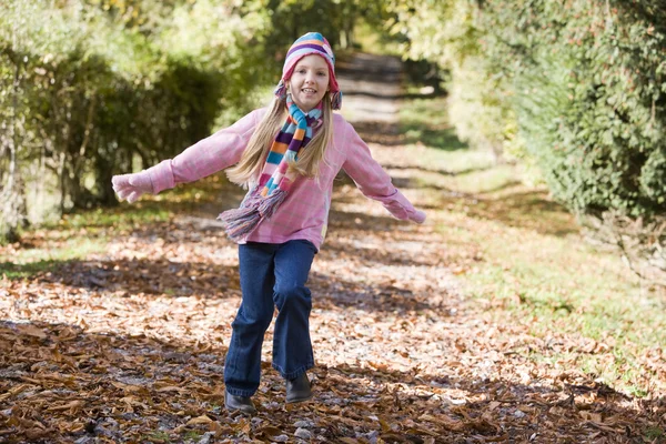 Young girl playing in woods — Stock Photo, Image