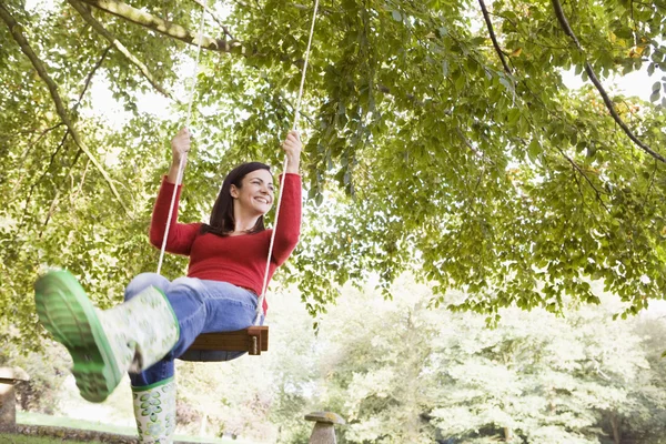 Young woman on swing — Stock Photo, Image