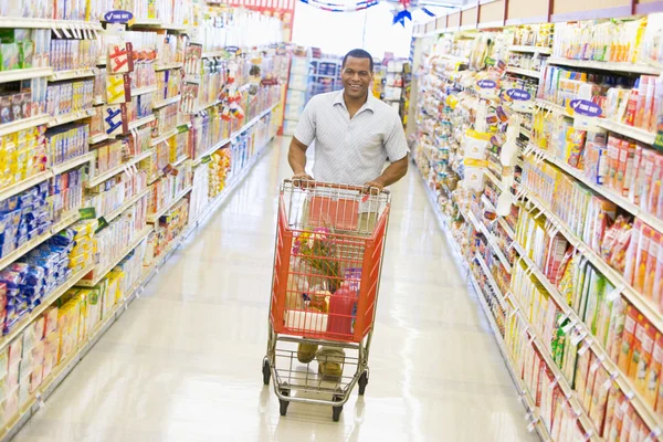 Young man grocery shopping — Stock Photo, Image