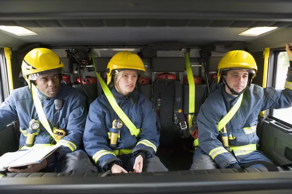 Firefighters on their way to an emergency scene — Stock Photo, Image