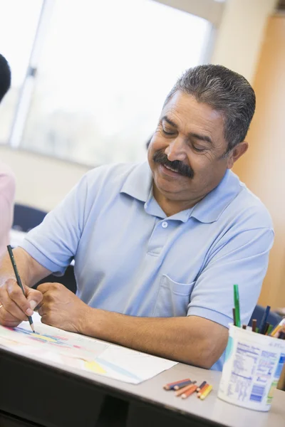 Mature male student in art class — Stock Photo, Image