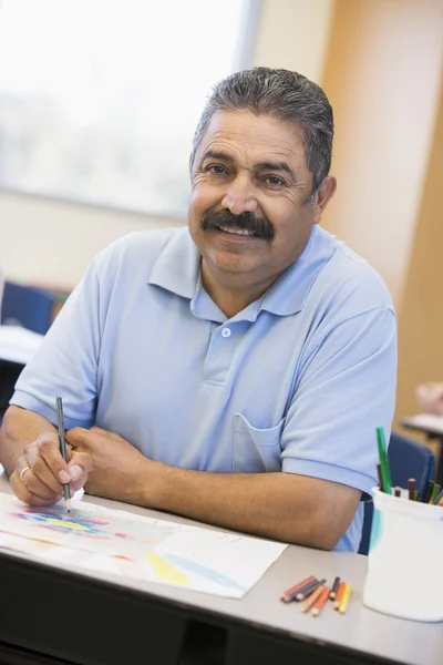 Mature male student in art class — Stock Photo, Image