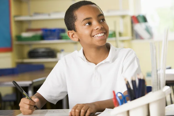A schoolboy studying in class — Stock Photo, Image