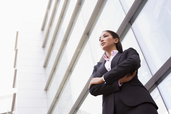 Businesswoman standing outside office building — Stock Photo, Image