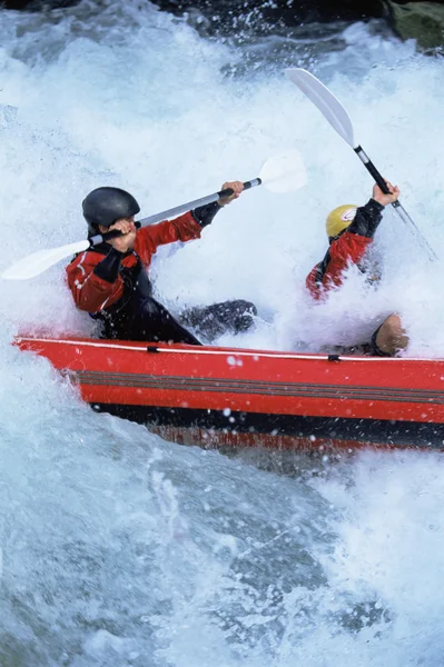 Two Paddling Inflatable Boat Rapids Stock Image