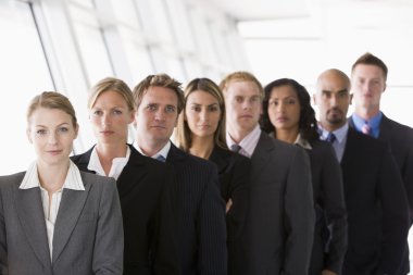 Group of office workers lined up facing camera clipart