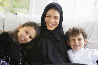 A Middle Eastern woman with her children clipart