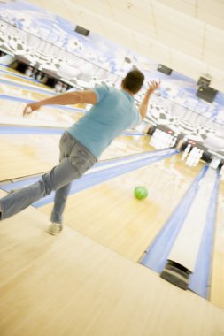 Man bowling, rear view clipart