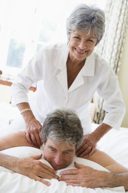 Man receiving a massage from a woman clipart