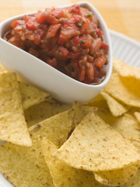 Pot Of Tomato Salsa with Tortilla Chips clipart