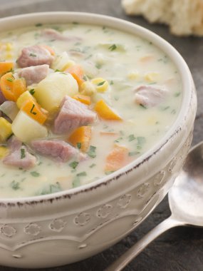 Bowl of Bacon and Corn Chowder with Soda Bread clipart