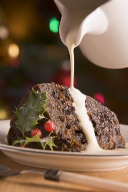 Portion of Christmas Pudding with Pouring Cream clipart