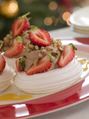 Meringue Nests filled with a Sweet Chestnut Cream and Strawberri clipart