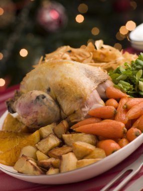 Pheasant Roasted with Orange Carrots Watercress and Parsnip Cris clipart