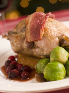 Roast Partridge Potato Cake Brussel Sprouts and Cranberry Jus clipart