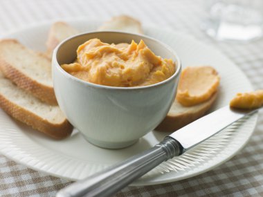 Bowl of Rouille with Croutes clipart