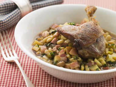 Confit Duck Leg with Flageolet Beans and Bacon clipart