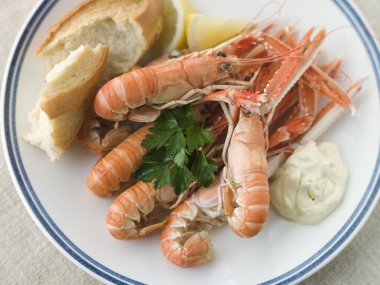 Langouste with Garlic Mayonnaise Lemon and Crusty baguette clipart