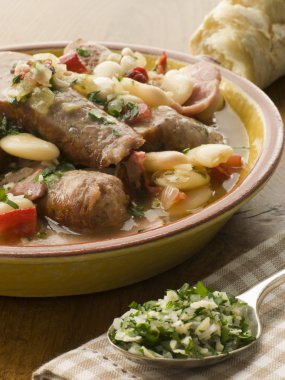 Bowl of Toulouse Sausage and Butter Bean Ragout with Persillade clipart