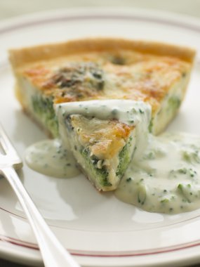 Broccoli and Roquefort Quiche with Broccoli sauce clipart