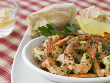 Dish of Garlic Buttered Tiger Prawns with Rustic Bread clipart